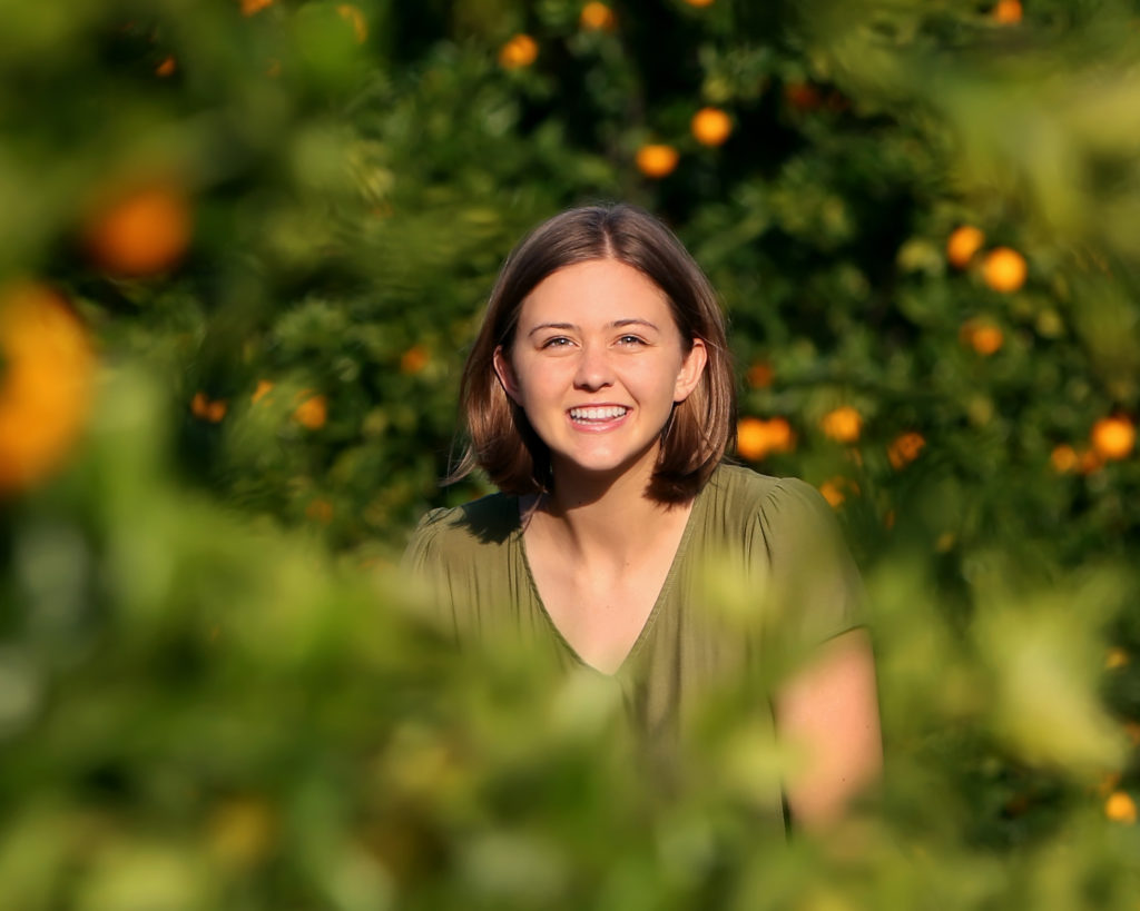 teen girl in orange grove