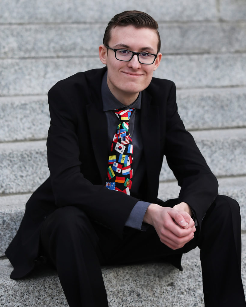 teen guy in suit and glasses