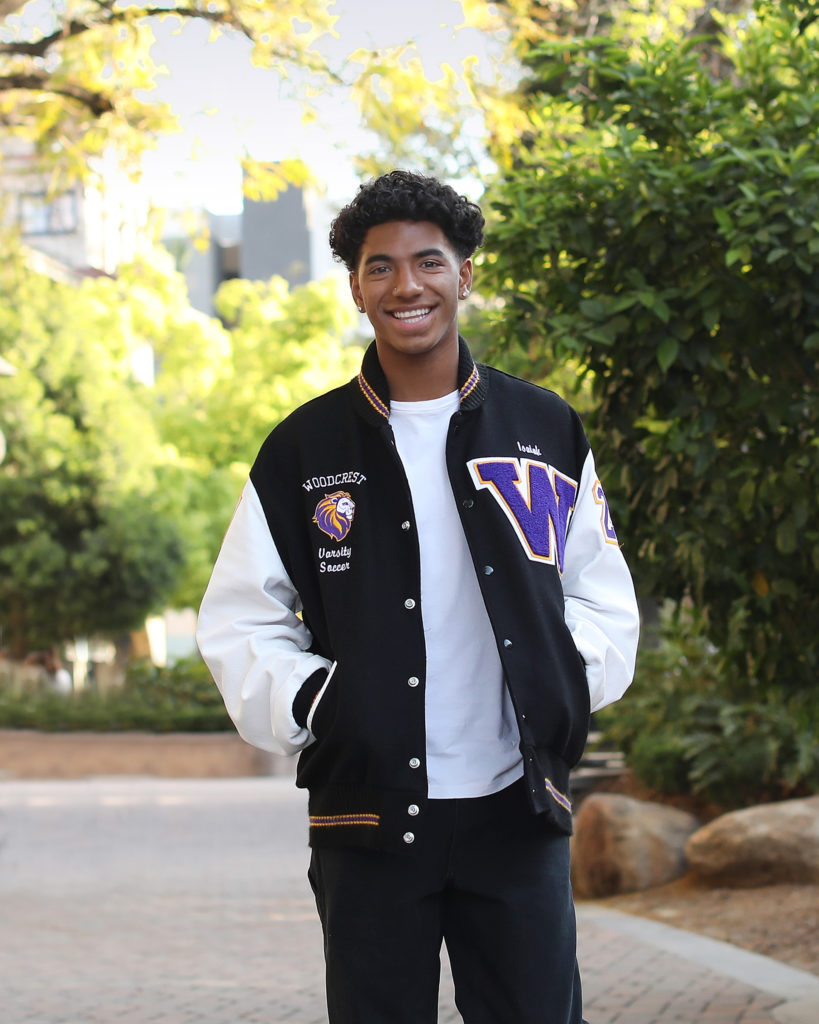 smiling teen guy in lettermans jacket