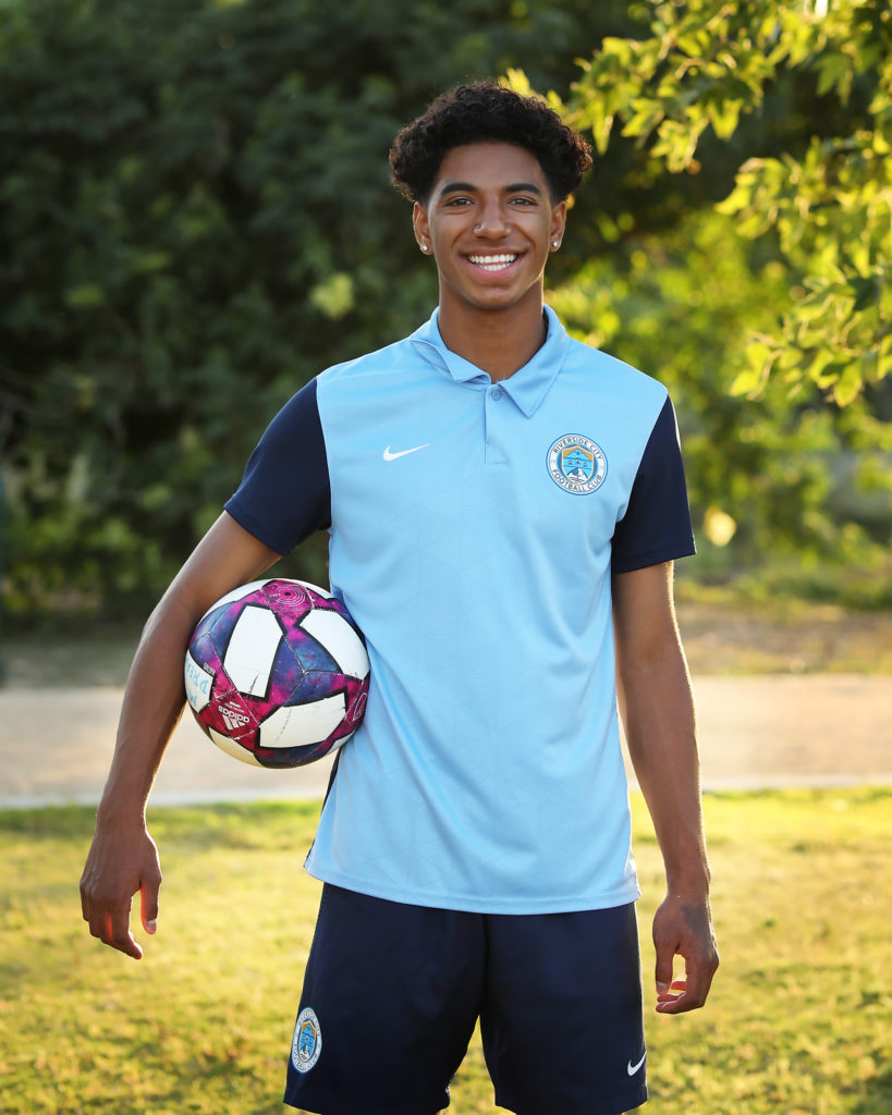 teen guy with soccer ball